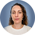 Maria Tzedaki from Constellium in front of a plain blue circular background